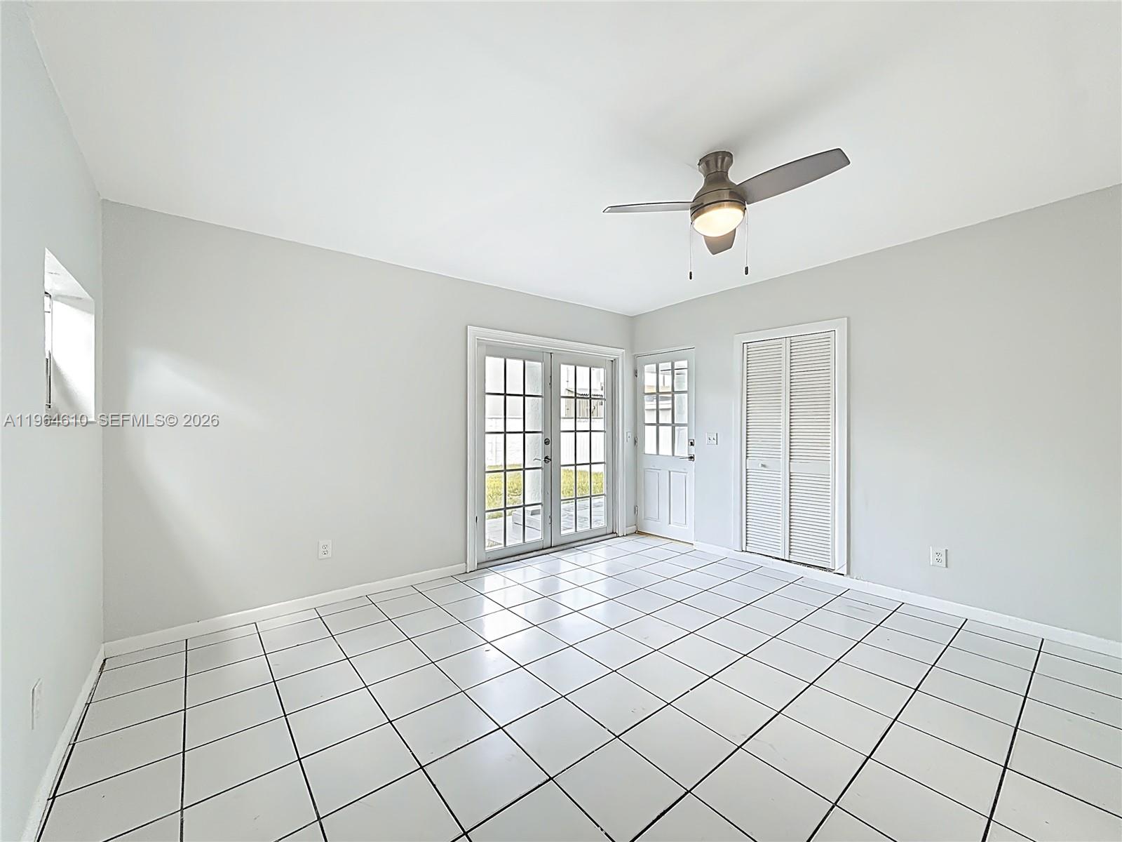 6819 Southwest 25th Street Miami, FL 33155 - Photo 8 of 25 a view of an empty room and window