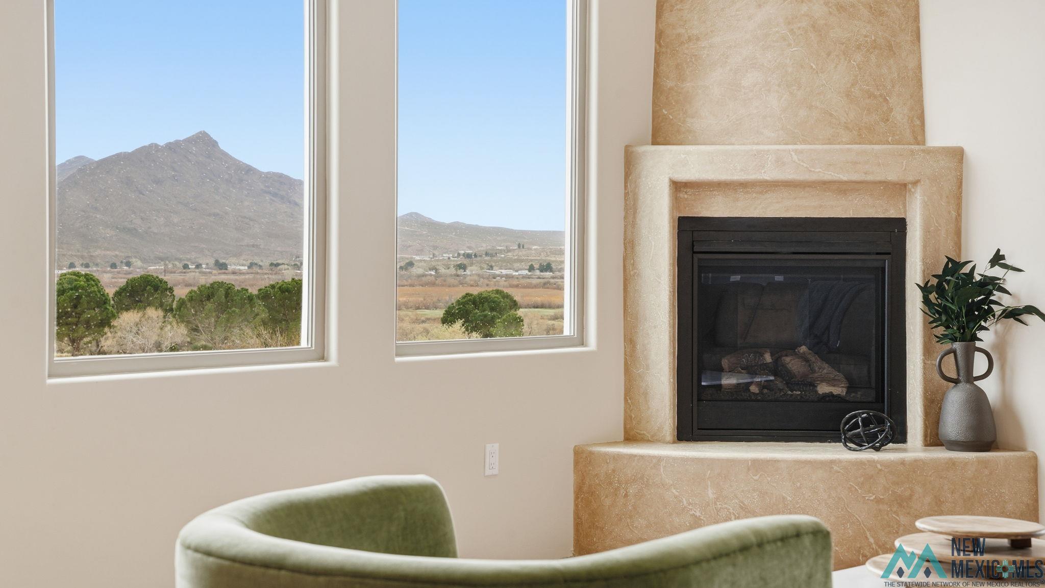119 Mesa Grande Road Elephant Butte, NM 87935 - Photo 28 of 34 Detailed view of a high end fireplace and a mountain backdrop