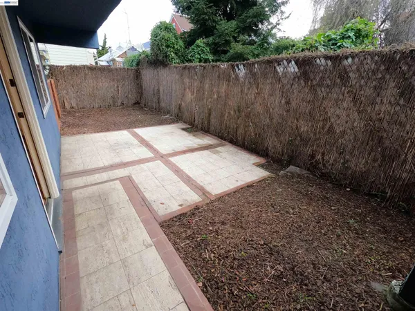 a view of outdoor space with wooden fence