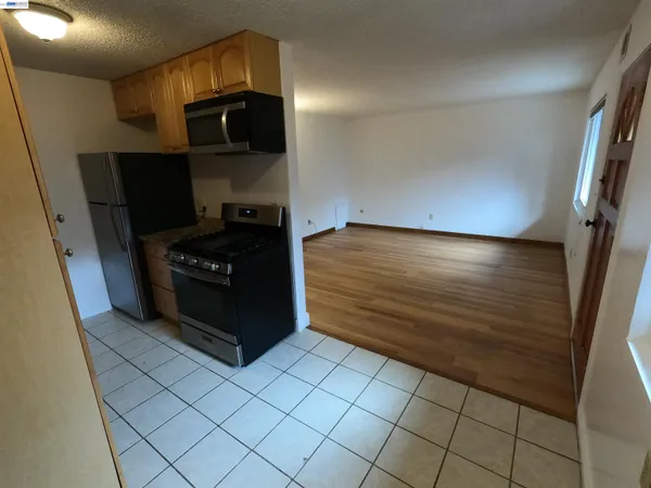 a kitchen with a stove and a microwave