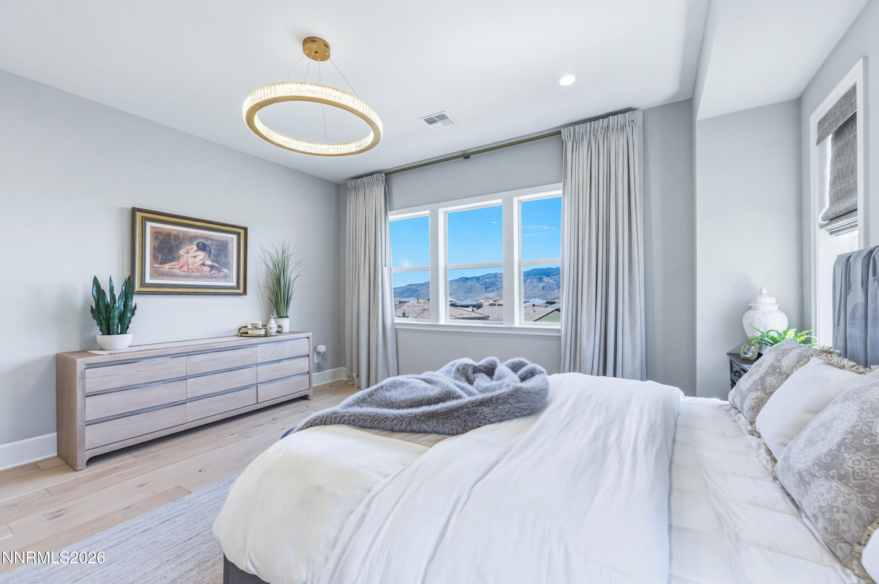 9028 Iron Sky Court Reno, NV 89523 - Photo 12 of 36 a bedroom with a bed and a large window
