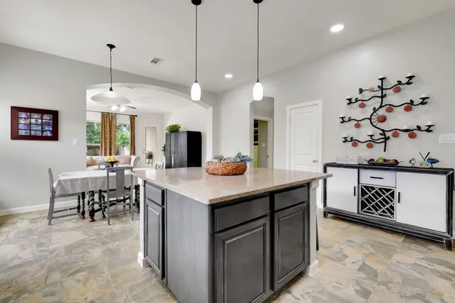 a kitchen with a table and chairs in it