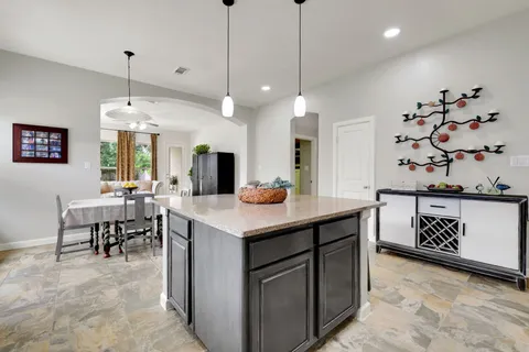 a kitchen with a table and chairs in it
