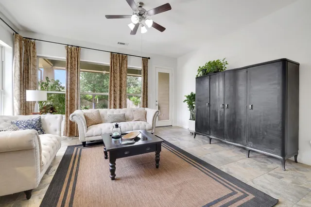 a living room with furniture and window