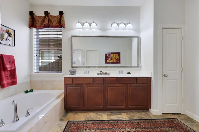 a bathroom with a bathtub and a sink