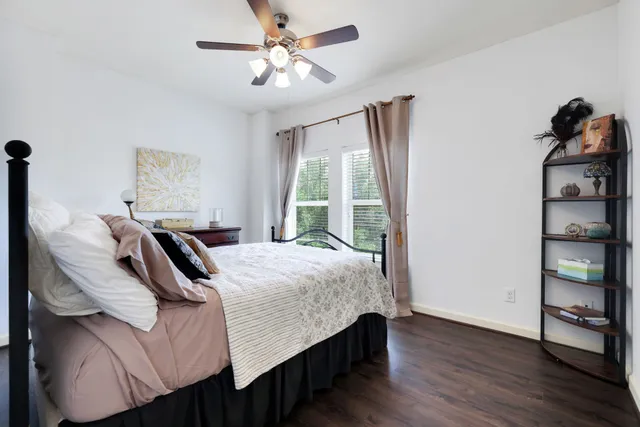 a bedroom with a bed and a chair