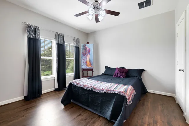 a bed sitting in a bedroom next to a window