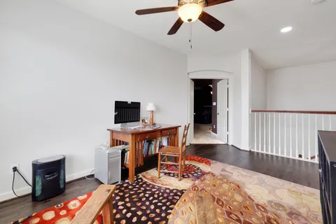 a bedroom with furniture and a window