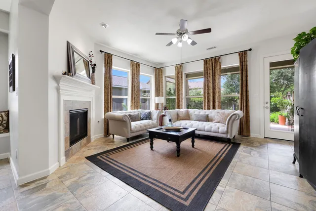 a living room with furniture and a fireplace