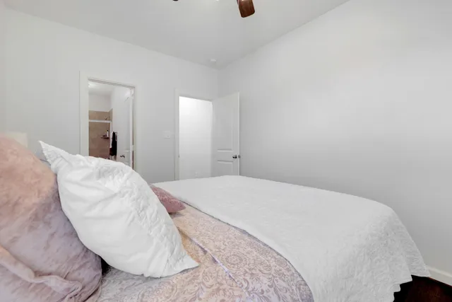 a bedroom with a bed and a chair