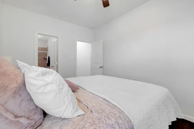 a bedroom with a bed and a chair