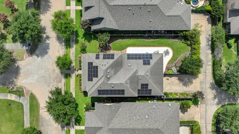 an aerial view of a house with a garden