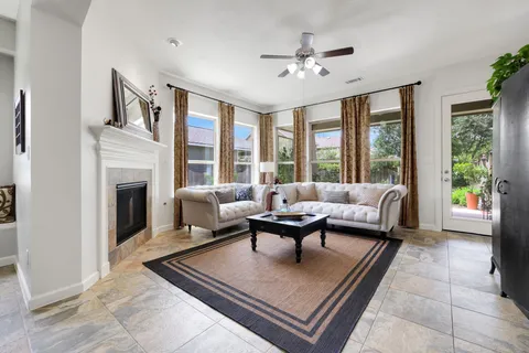 a living room with furniture and a fireplace