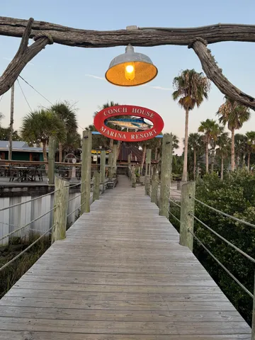 a swimming pool view with a seating space