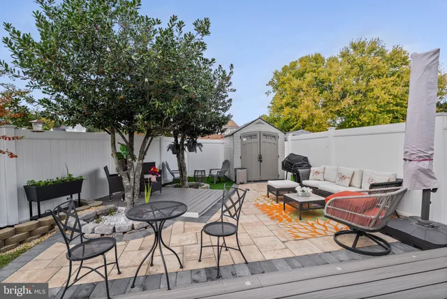 a view of outdoor seating space with furniture and garden