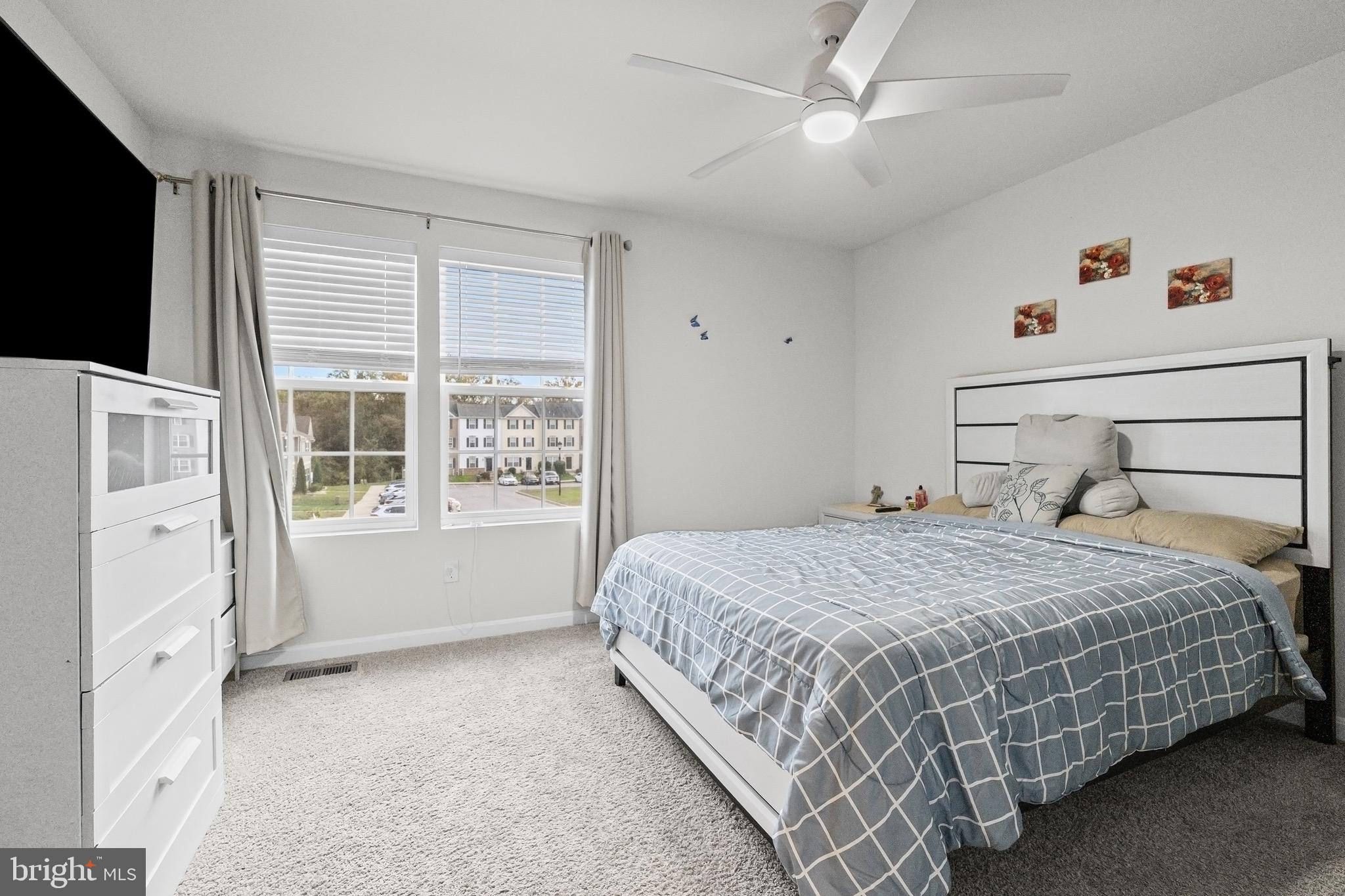 1901 Graymount Way Edgewood, MD 21040 - Photo 11 of 24 a bedroom with a large bed and a flat tv screen on dresser