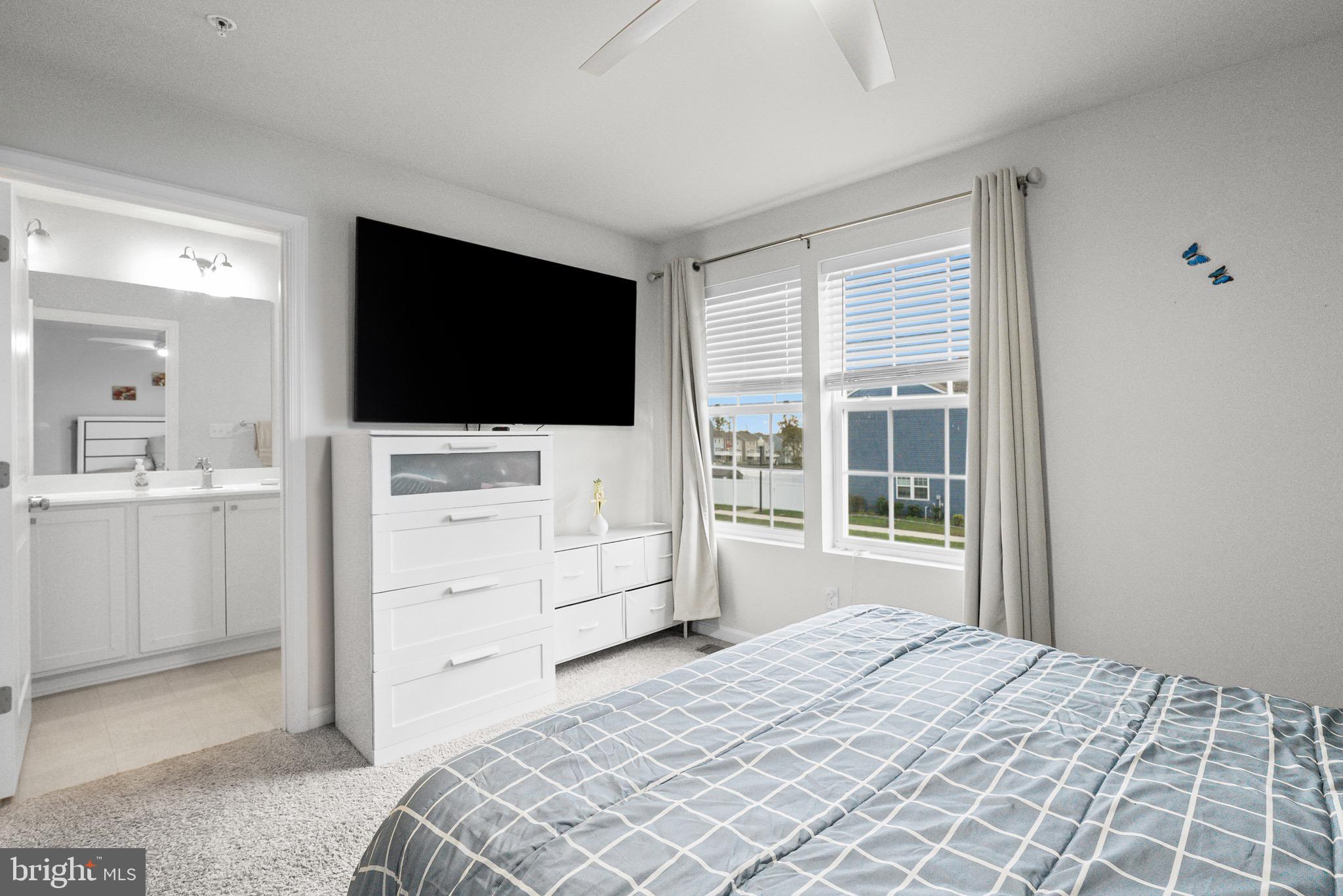 1901 Graymount Way Edgewood, MD 21040 - Photo 12 of 24 a bedroom with a bed and a flat screen tv