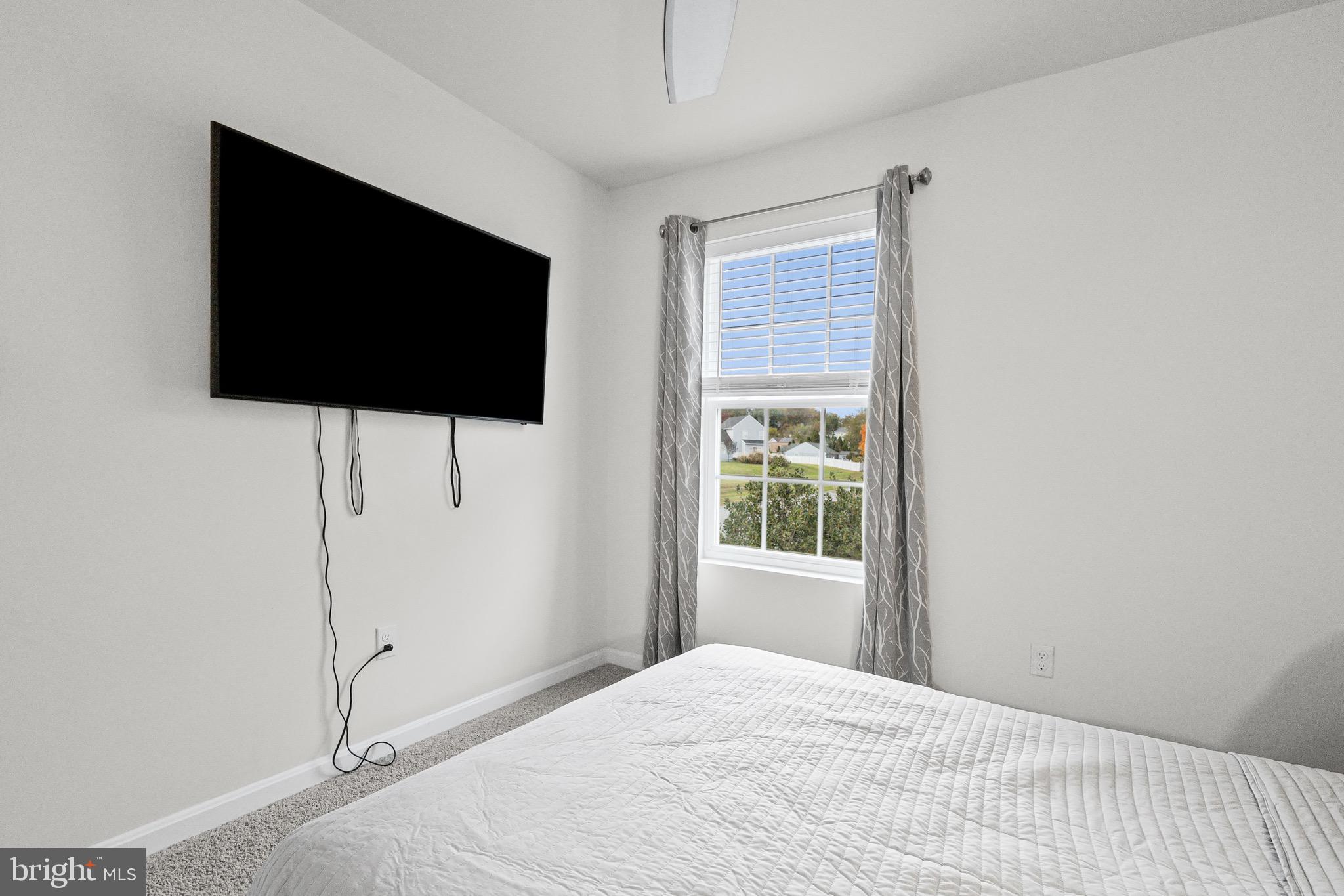 1901 Graymount Way Edgewood, MD 21040 - Photo 15 of 24 a bedroom with a flat screen tv and a window