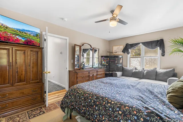 a view of a swimming pool with a patio and a yard