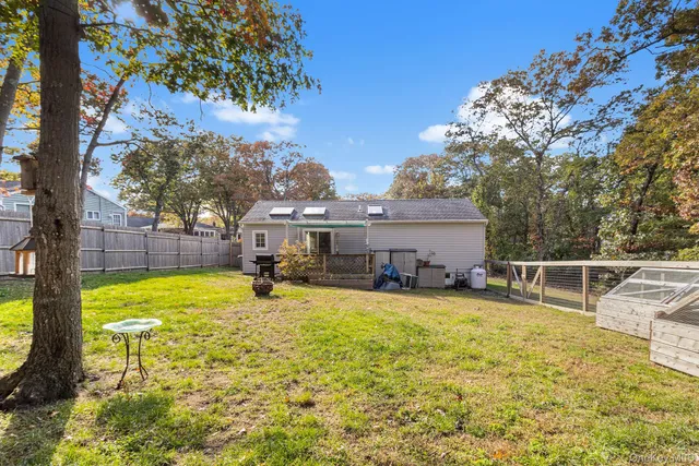 a view of a swimming pool with a patio and a yard