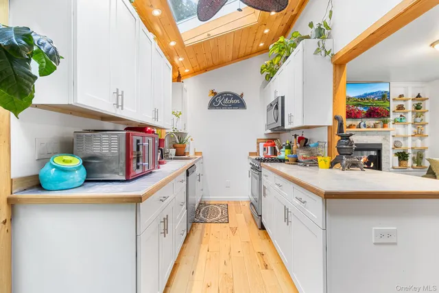 a kitchen with counter top space and cabinets