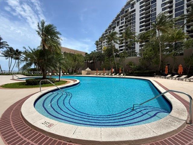 540 Brickell Key Drive, Unit 1024 Miami, FL 33131 - Photo 7 of 28 a view of swimming pool with outdoor seating