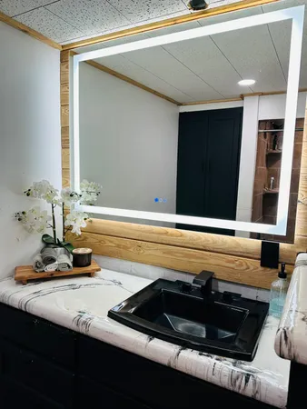 a view of a living room and bathroom