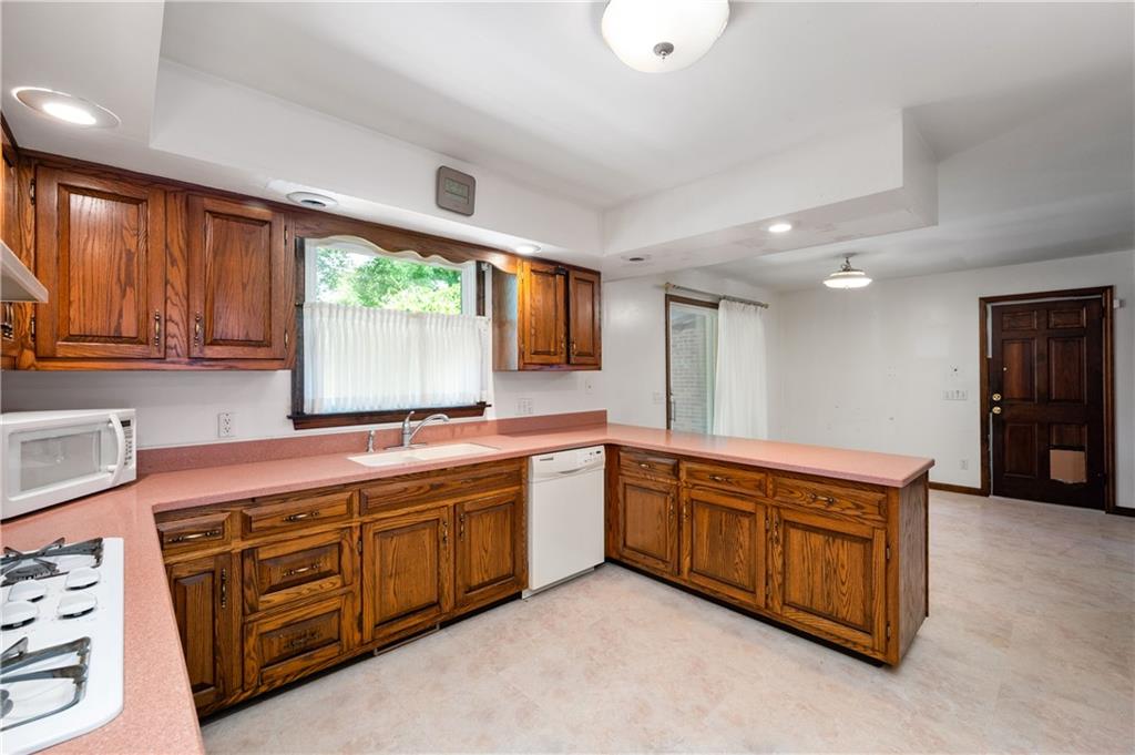 110 Rittswood Drive Butler, PA 16001 - Photo 8 of 28 a large kitchen with stainless steel appliances granite countertop a stove a sink and a microwave