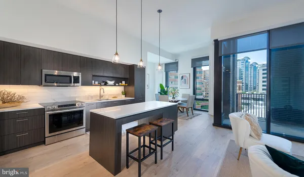 a kitchen with stainless steel appliances granite countertop a stove and a refrigerator