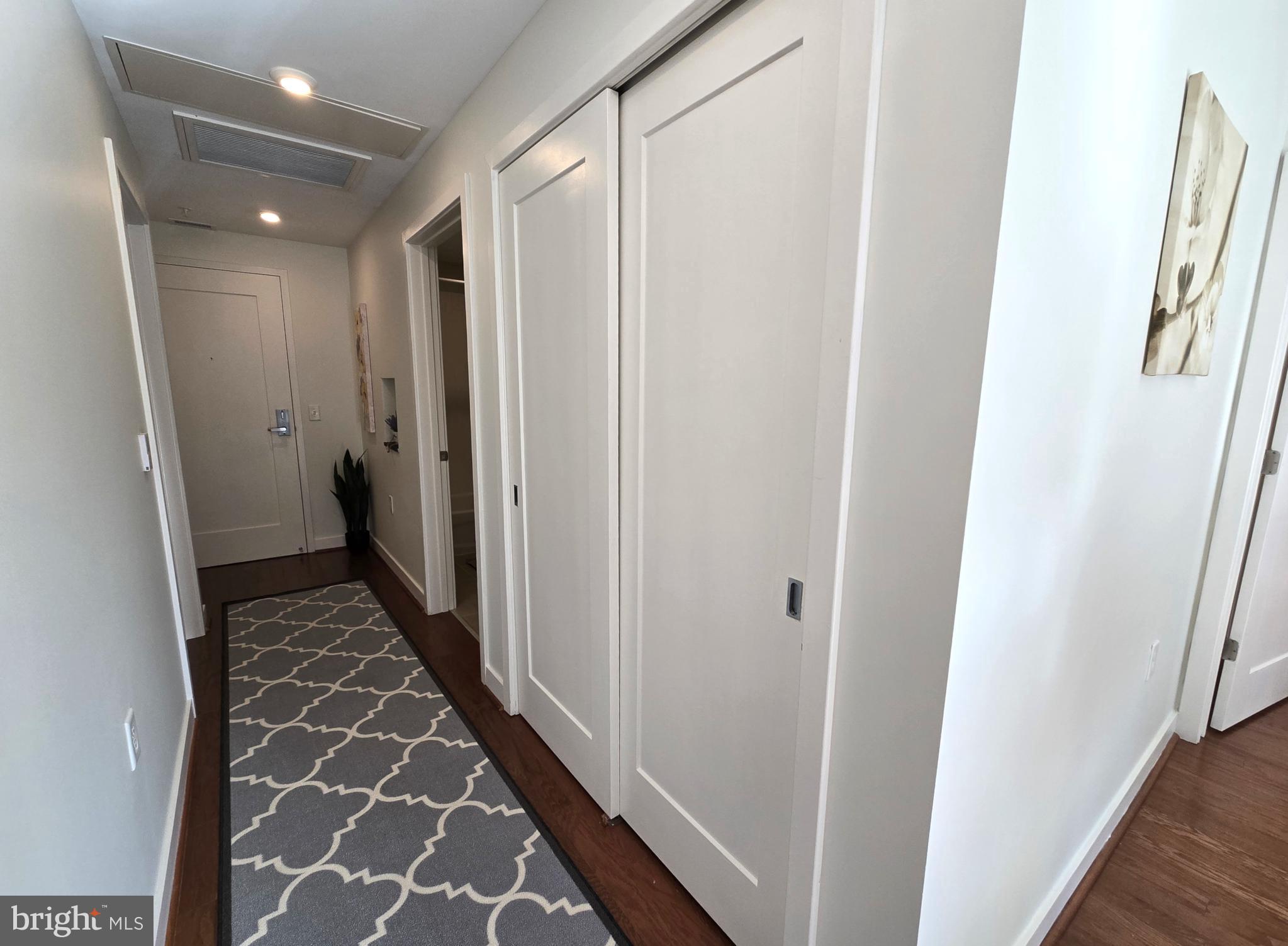1320 Fenwick Lane, Unit 508 Silver Spring, MD 20910 - Photo 20 of 47 a view of hallway with wooden floor