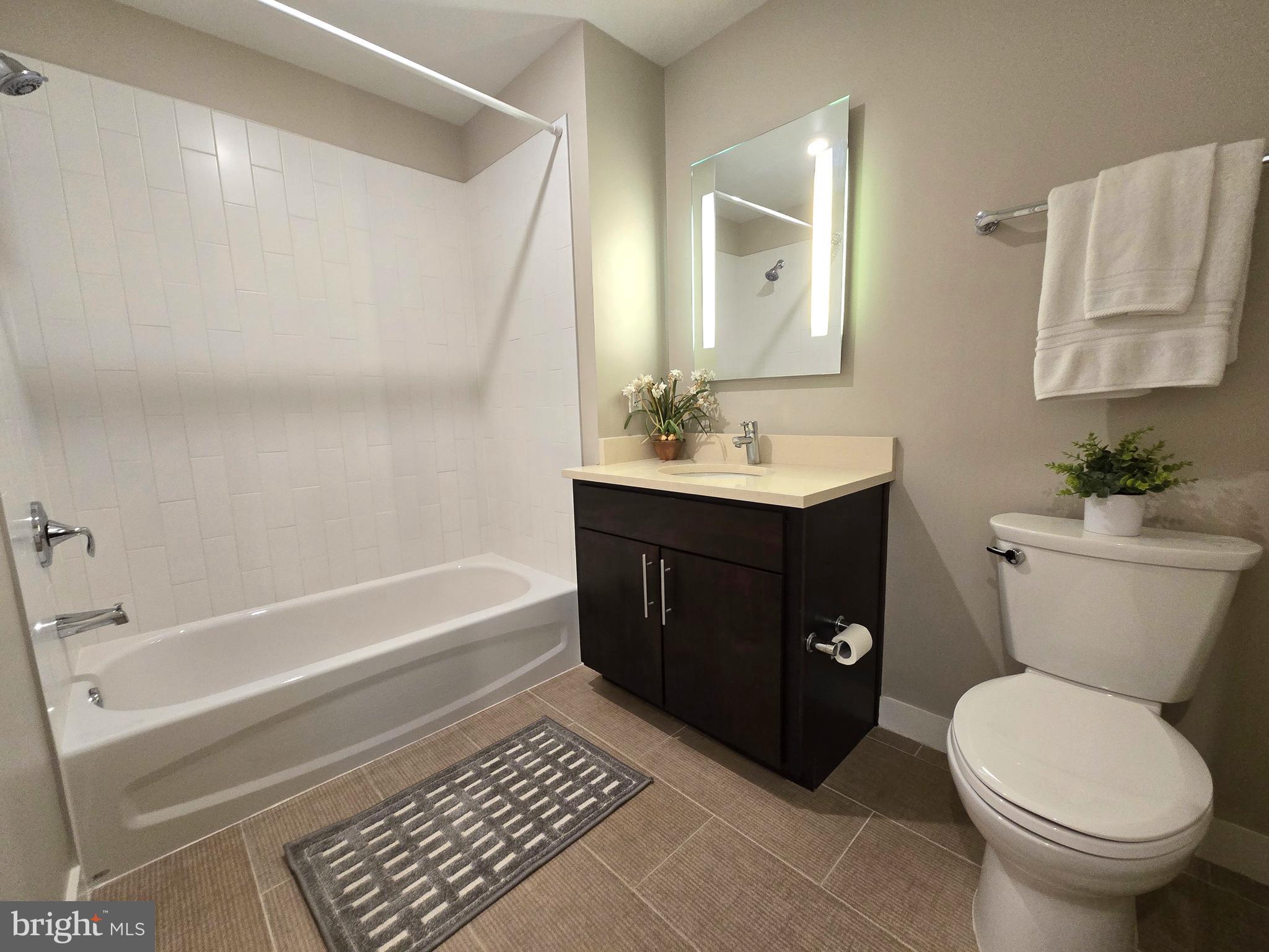1320 Fenwick Lane, Unit 508 Silver Spring, MD 20910 - Photo 25 of 47 a bathroom with a sink a toilet and bathtub