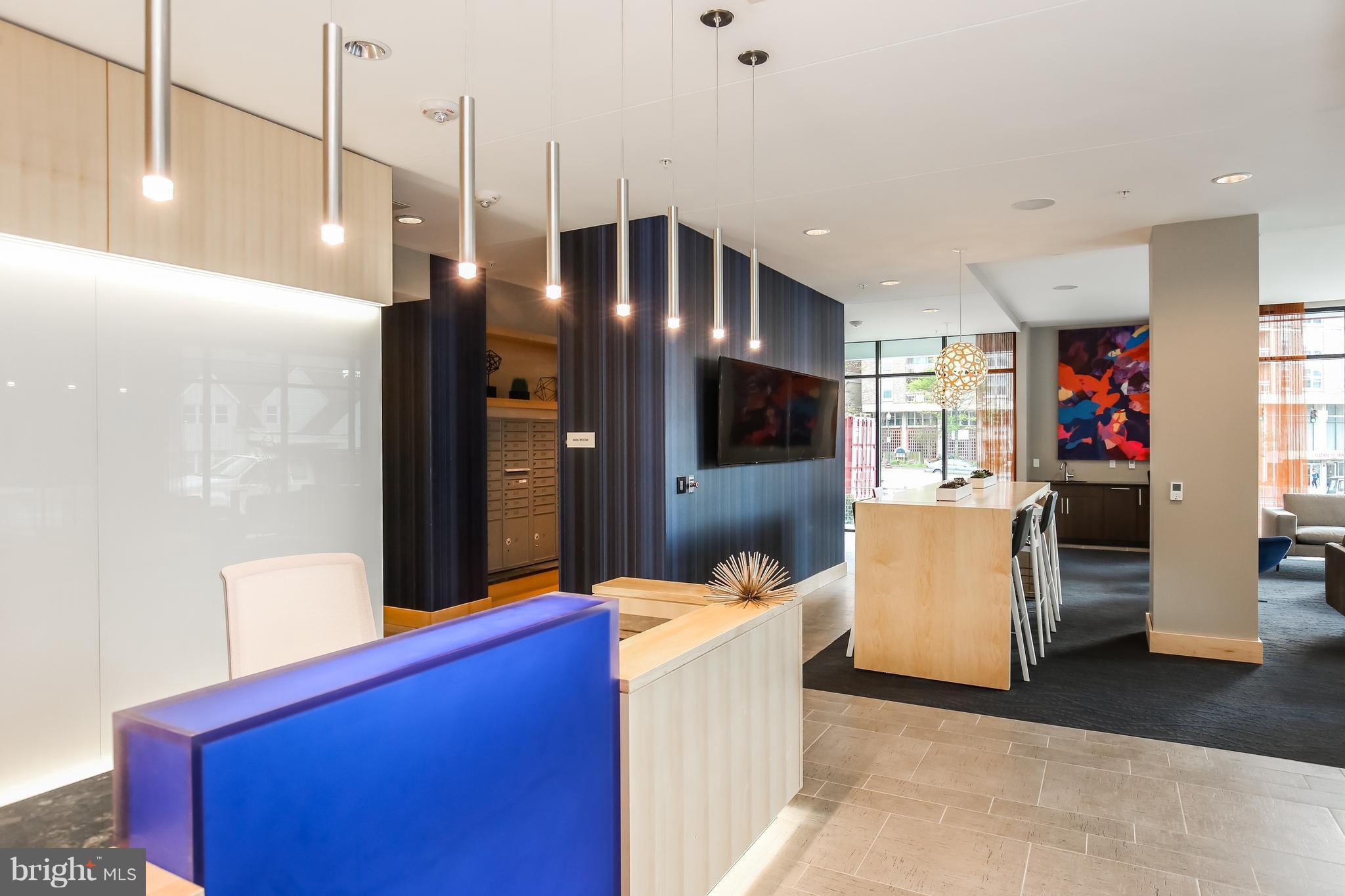 1320 Fenwick Lane, Unit 508 Silver Spring, MD 20910 - Photo 29 of 47 a living room with furniture and a flat screen tv