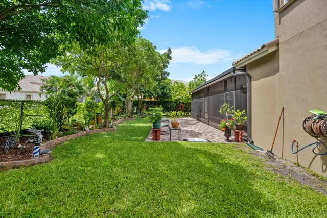 a view of a chair and table in backyard