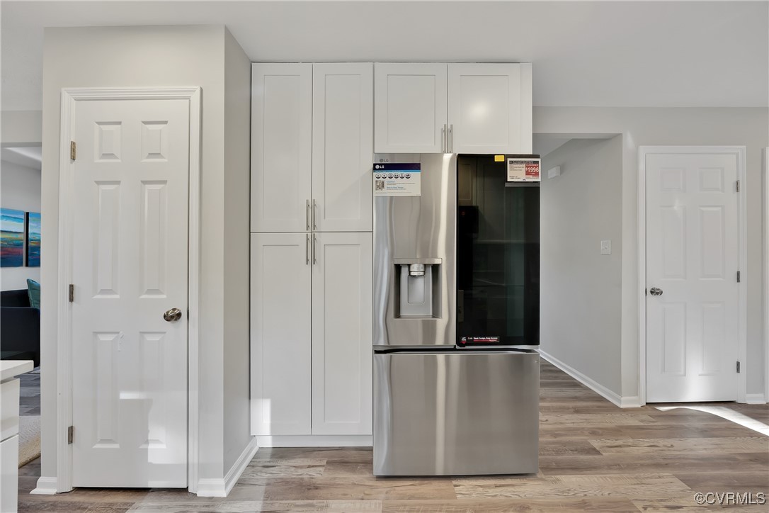11202 Heathstead Road Chester, VA 23831 - Photo 13 of 50 Kitchen with stainless steel fridge, white cabinet