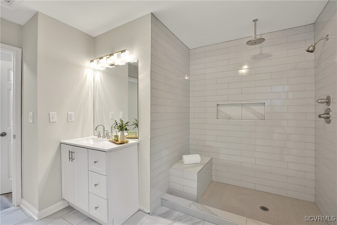 11202 Heathstead Road Chester, VA 23831 - Photo 18 of 50 Full bath featuring a tile shower, baseboards, and