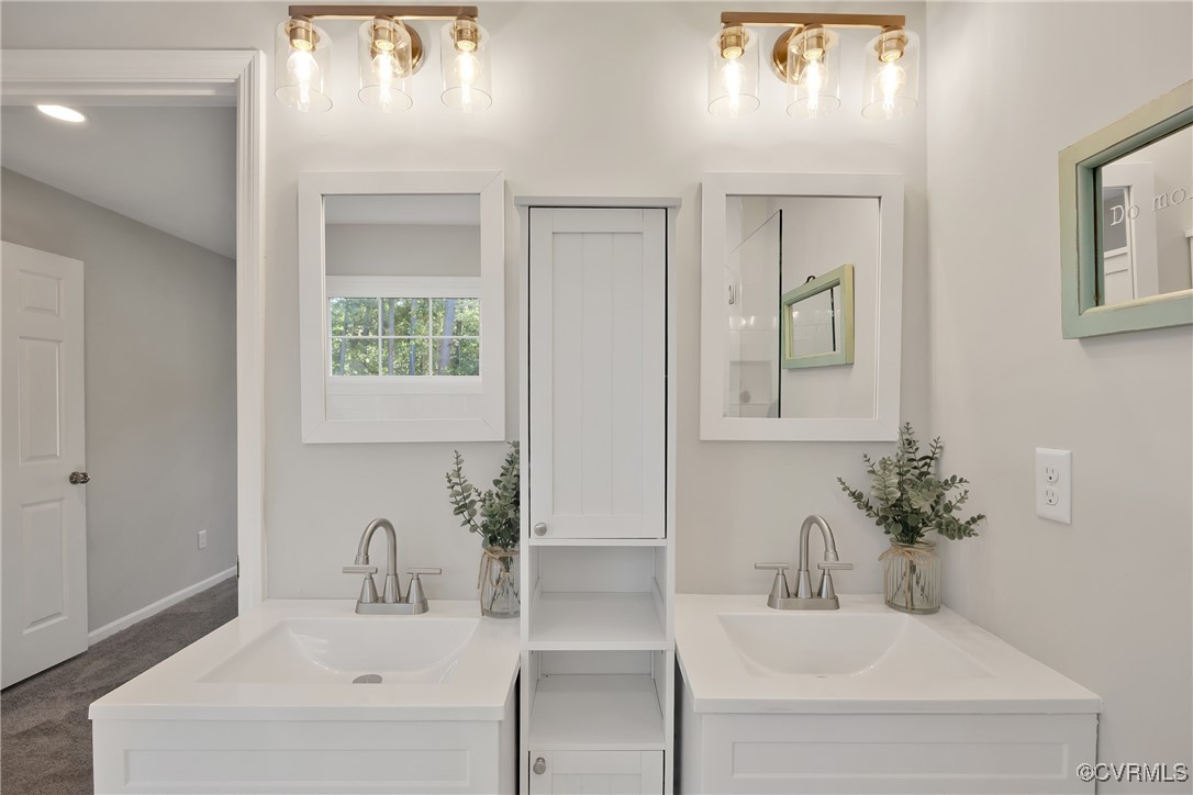 11202 Heathstead Road Chester, VA 23831 - Photo 25 of 50 Full bath with two vanities and baseboards