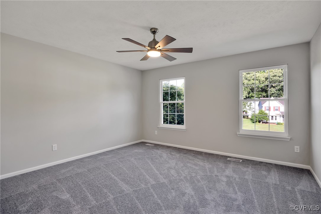 11202 Heathstead Road Chester, VA 23831 - Photo 28 of 50 Carpeted spare room featuring ceiling fan and base