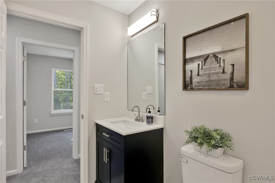 11202 Heathstead Road Chester, VA 23831 - Photo 33 of 50 Half bath featuring vanity, toilet, and baseboards