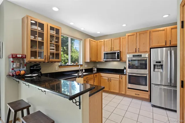 a kitchen with a refrigerator a stove a sink and dishwasher