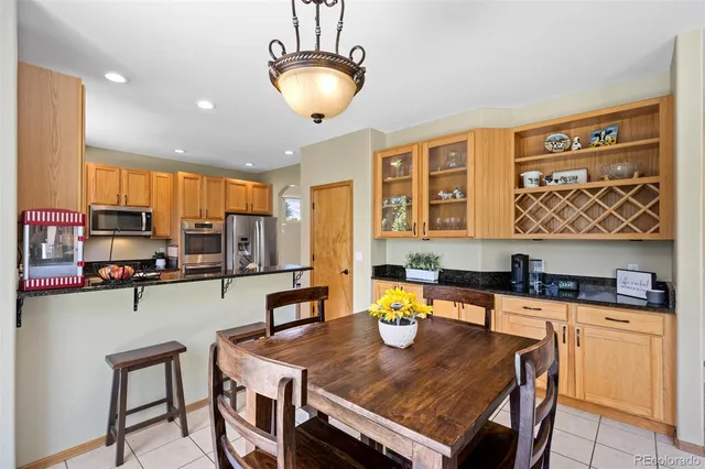 a kitchen with stainless steel appliances granite countertop a sink and cabinets
