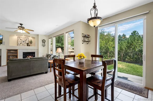 a view of kitchen and dining area with chandelier