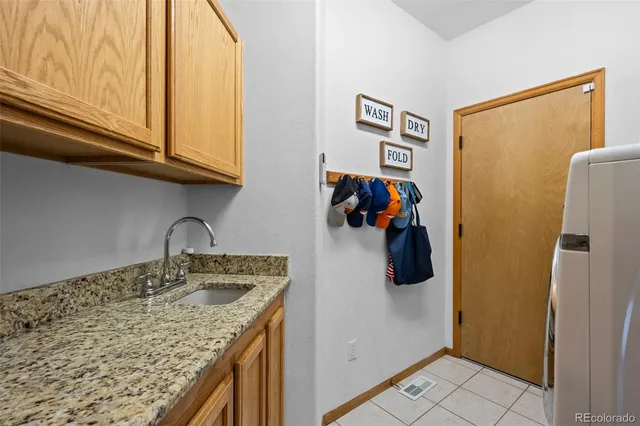 a spacious bedroom with a bed and a window