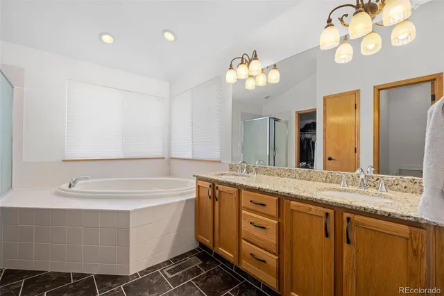 a bathroom with a tub and a shower