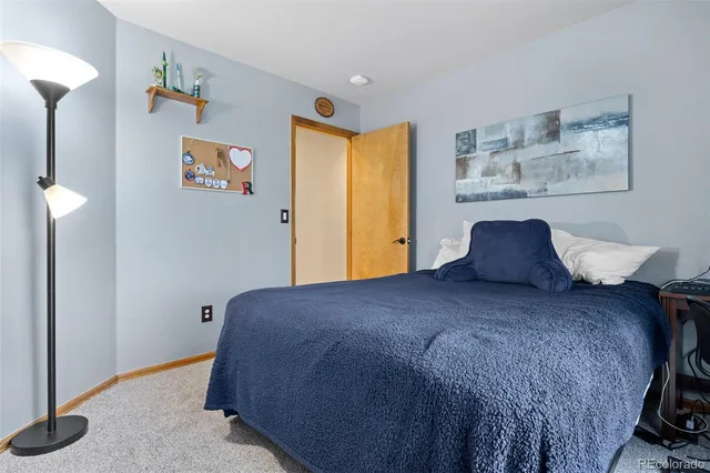 a view of an empty room with stairs and ventilation