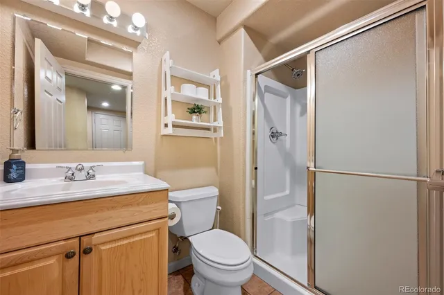 a building outdoor space with patio furniture and garden