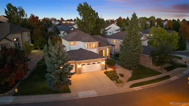 an aerial view of residential houses with outdoor space and street view