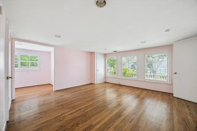 a view of a park with a tree in the background
