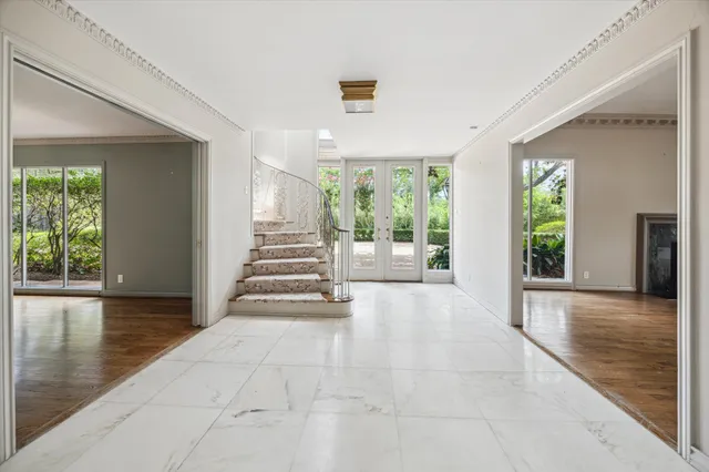 a view of an entryway with wooden floor and windows