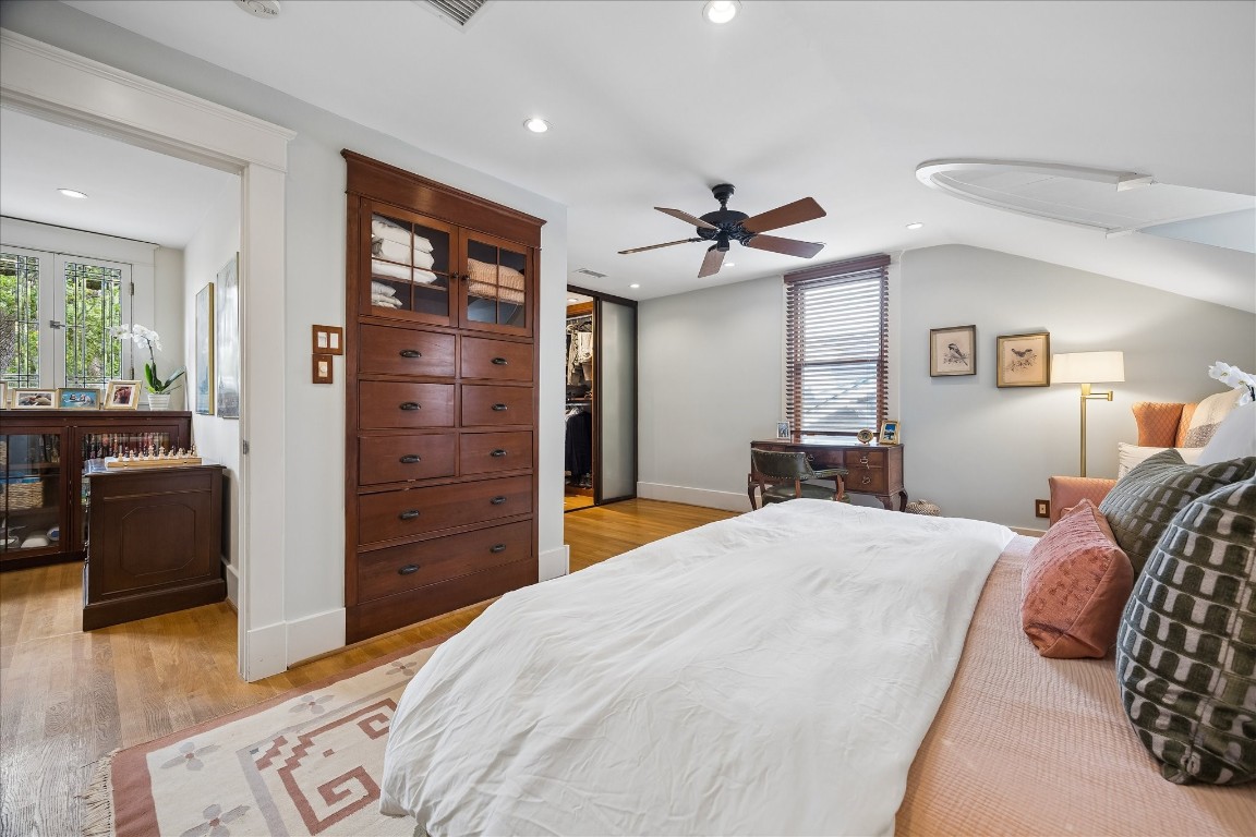 1705 Haver Street Houston, TX 77006 - Photo 12 of 31 Another view of the Primary Bedroom shows some of the tasteful built-ins as well as the walk-in closet