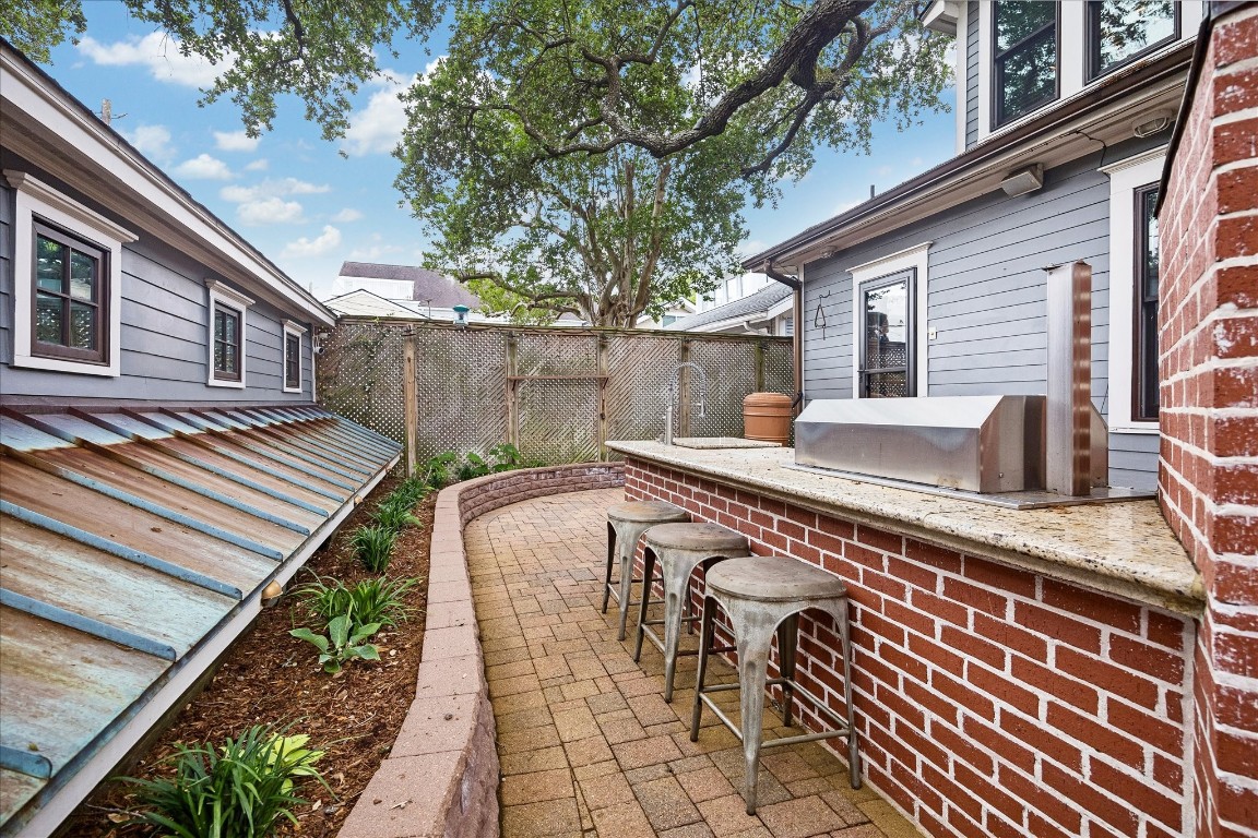 1705 Haver Street Houston, TX 77006 - Photo 29 of 31 Seating at the outdoor Kitchen is perfect for entertaining